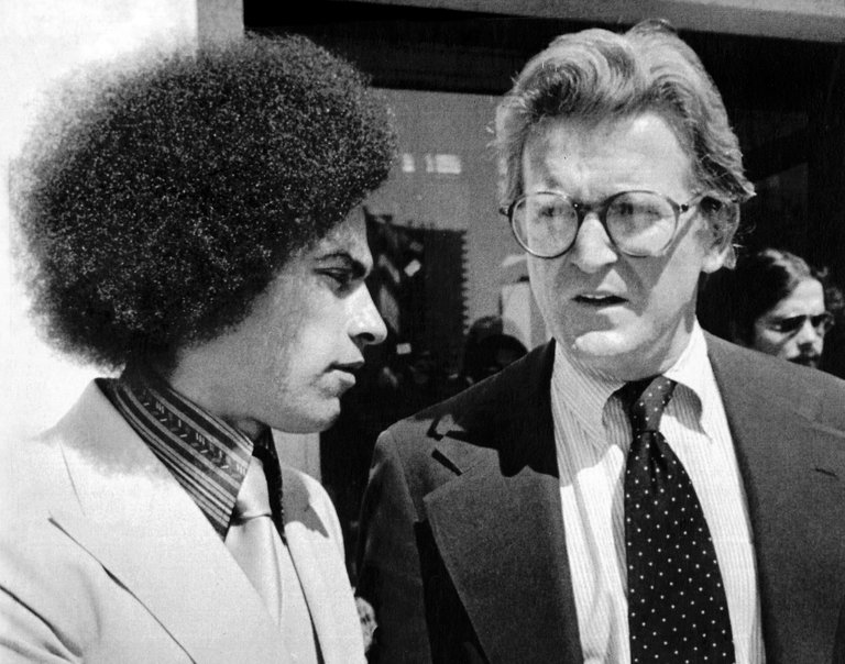 Michael Kennedy (right) with client Huey Newton (left) outside the Alameda County Court House, 1978. (Photo: United Press International)
