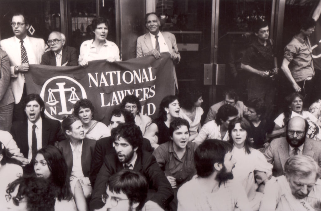Michael Ratner (second row, far right) protests U.S. aid to the Contras in Nicaragua at a sit-in organized by the NLG-NYC Chapter in front of 26 Federal Plaza in Downtown Manhattan, 1984 (Photo: John Snow).